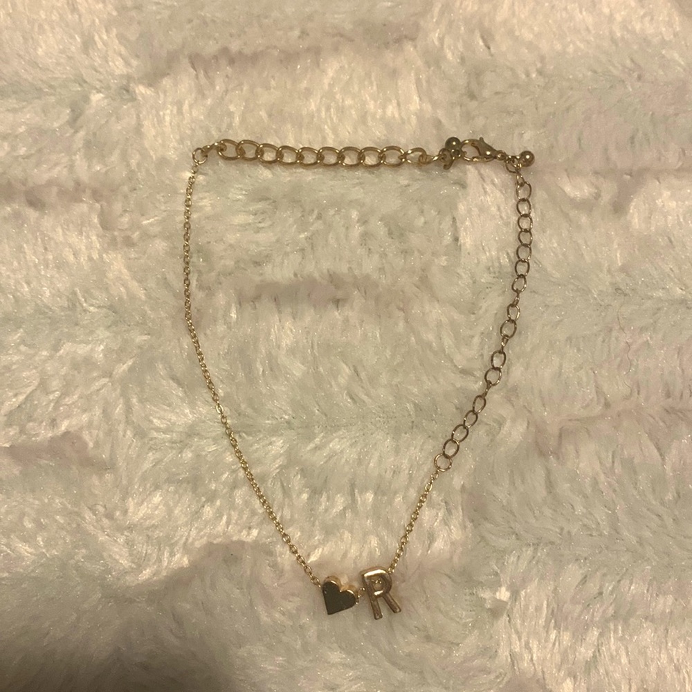Bracelet price is CAN$15 with a letter R it used but still good to wear and gold